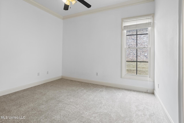 unfurnished room with crown molding, ceiling fan, and carpet