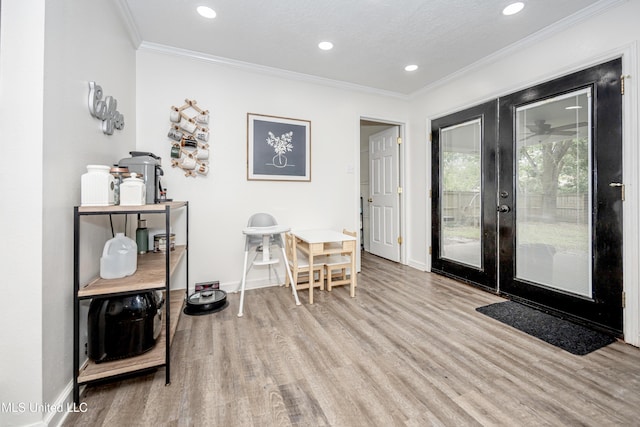 interior space featuring ornamental molding, french doors, recessed lighting, and wood finished floors