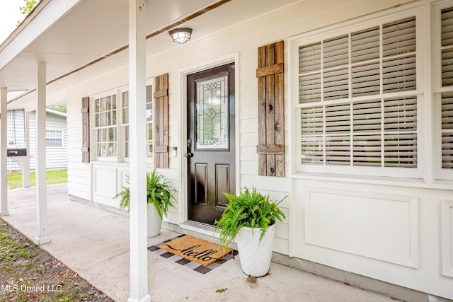 doorway to property with a porch