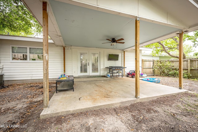view of patio / terrace featuring ceiling fan, fence, and french doors
