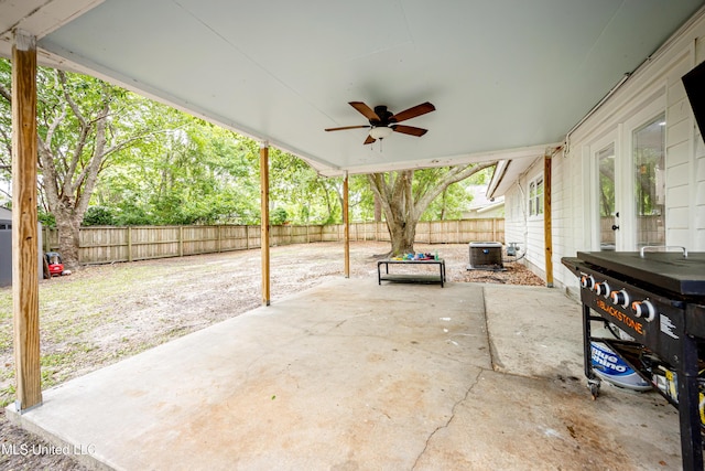 view of patio / terrace featuring central AC, a ceiling fan, and a fenced backyard