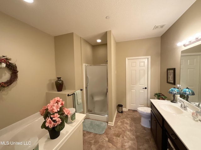 full bathroom featuring vanity, toilet, separate shower and tub, and a textured ceiling