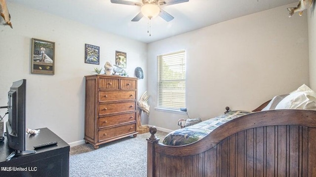 bedroom featuring light carpet and ceiling fan