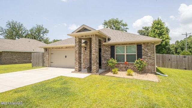 view of front of home featuring a garage and a front lawn