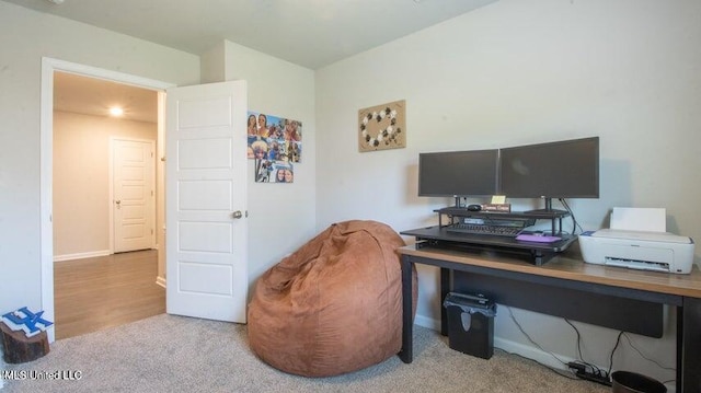 home office featuring light colored carpet