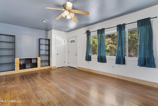 1278 Lopez Pl, Biloxi, MS 39530 - unfurnished living room featuring wood finished floors, healthy amount of natural light, and ceiling fan