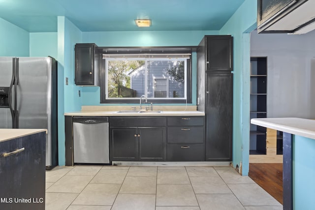 1278 Lopez Pl, Biloxi, MS 39530 - kitchen featuring stainless steel appliances, a sink, light countertops, and dark cabinets