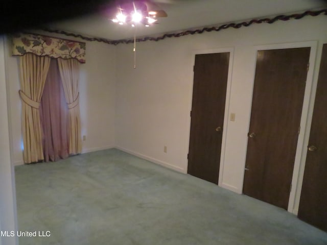 unfurnished bedroom with light colored carpet