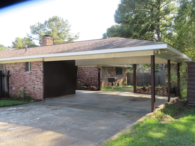 view of vehicle parking featuring a carport