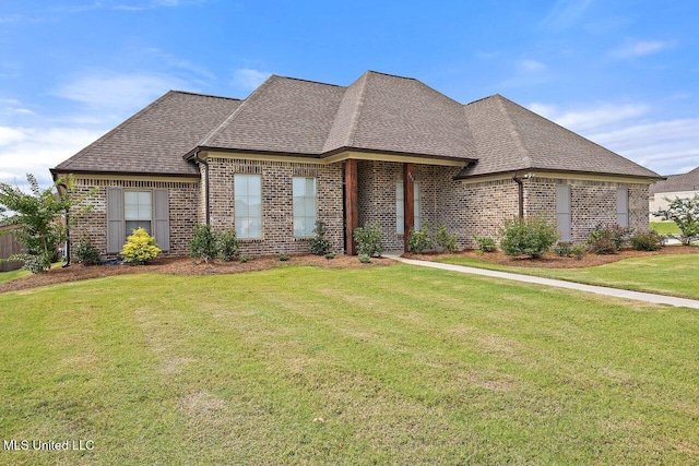 953 Glenwild Cir, Canton, MS 39046 - french provincial home with brick siding, a shingled roof, and a front lawn
