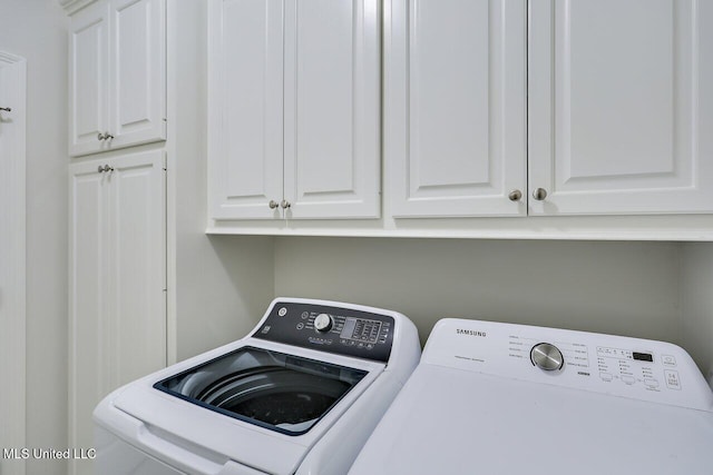 953 Glenwild Cir, Canton, MS 39046 - laundry area featuring washing machine and dryer and cabinet space