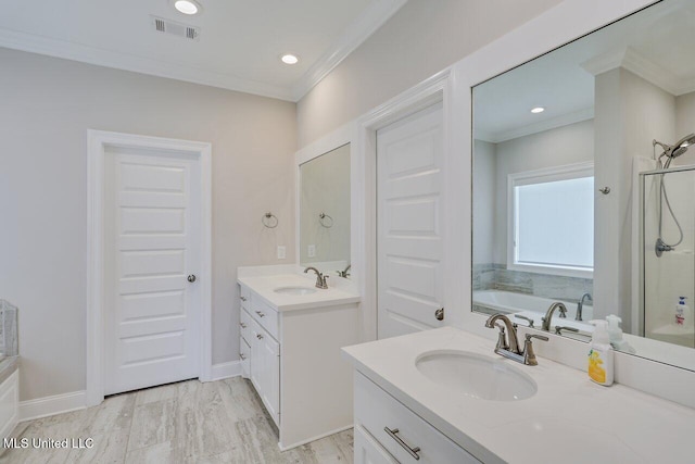 953 Glenwild Cir, Canton, MS 39046 - full bath featuring two vanities, a bath, a shower stall, crown molding, and recessed lighting