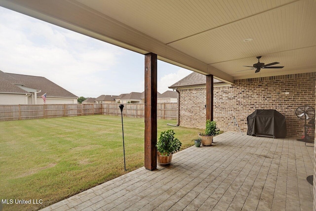 953 Glenwild Cir, Canton, MS 39046 - fenced backyard with a ceiling fan and a grill