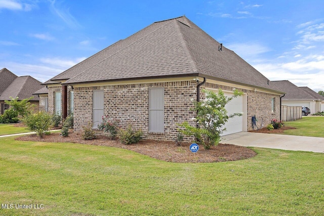 953 Glenwild Cir, Canton, MS 39046 - view of home's exterior with brick siding, a lawn, driveway, roof with shingles, and a garage