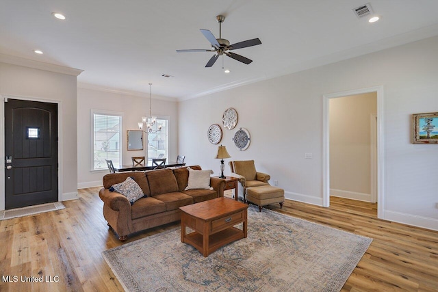 953 Glenwild Cir, Canton, MS 39046 - living room with light wood-style flooring, crown molding, ceiling fan, a chandelier, and recessed lighting