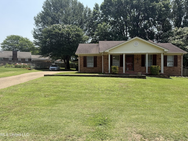 8528 E Cedar Cir, Southaven, MS 38671 - view of front of house with covered porch, concrete driveway, and brick siding