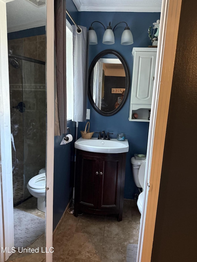 8528 E Cedar Cir, Southaven, MS 38671 - bathroom featuring a stall shower, crown molding, and vanity
