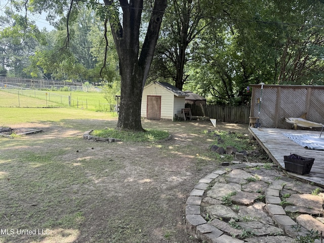 8528 E Cedar Cir, Southaven, MS 38671 - fenced backyard with a storage shed and a wooden deck