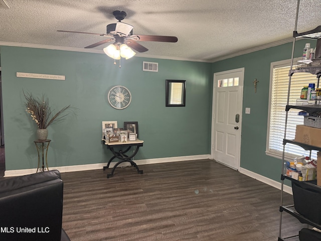 8528 E Cedar Cir, Southaven, MS 38671 - entryway featuring a ceiling fan, healthy amount of natural light, dark wood-type flooring, a textured ceiling, and crown molding