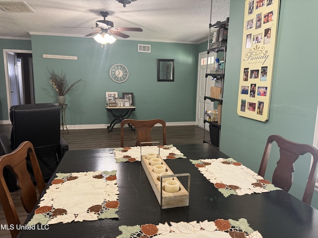8528 E Cedar Cir, Southaven, MS 38671 - dining room featuring ornamental molding, ceiling fan, a textured ceiling, and dark wood finished floors