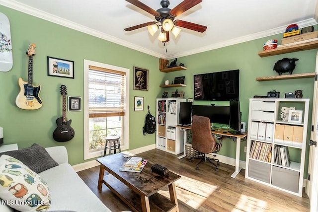 interior space with ceiling fan, crown molding, baseboards, and wood finished floors