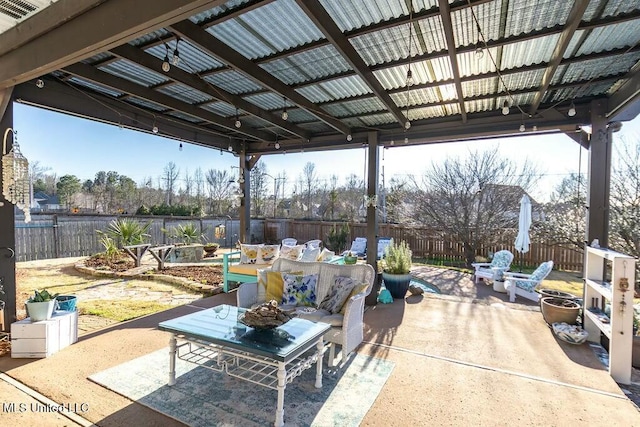 view of patio featuring a fenced backyard and outdoor dining area