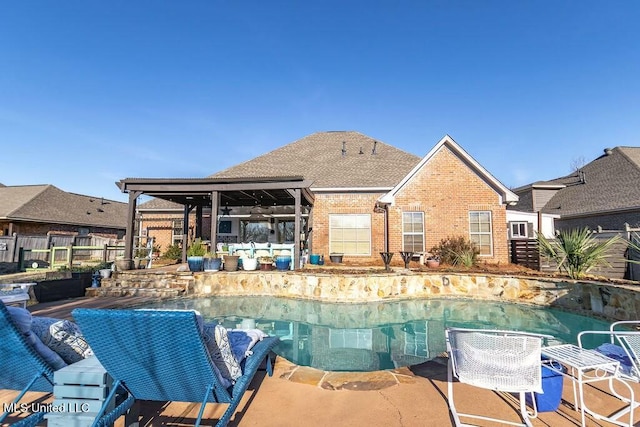 view of swimming pool featuring a patio area, fence, and a fenced in pool