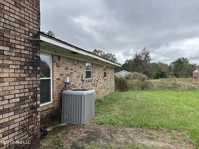 view of yard featuring central AC