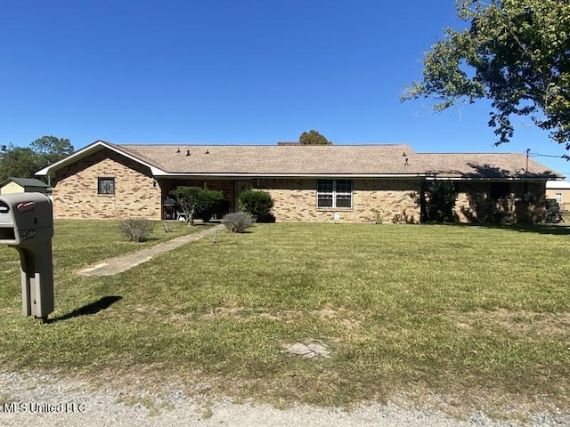 ranch-style home with a front yard