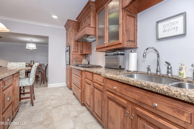 kitchen featuring sink, crown molding, black oven, and dark stone countertops