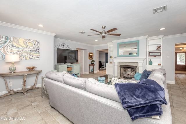 living room featuring ceiling fan, crown molding, and a textured ceiling