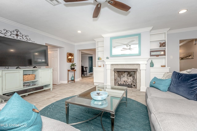 tiled living room with crown molding, built in shelves, and ceiling fan