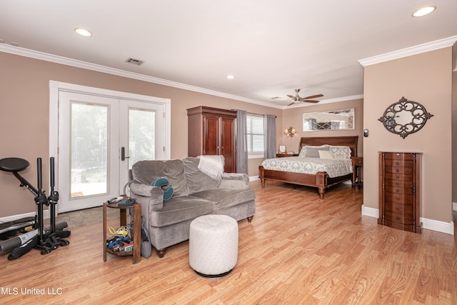 bedroom with light hardwood / wood-style floors, ornamental molding, multiple windows, and ceiling fan