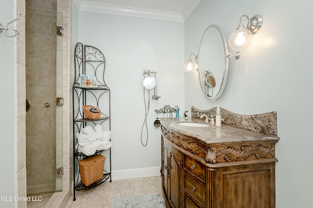 bathroom featuring a shower with door, vanity, ornamental molding, and tile patterned flooring