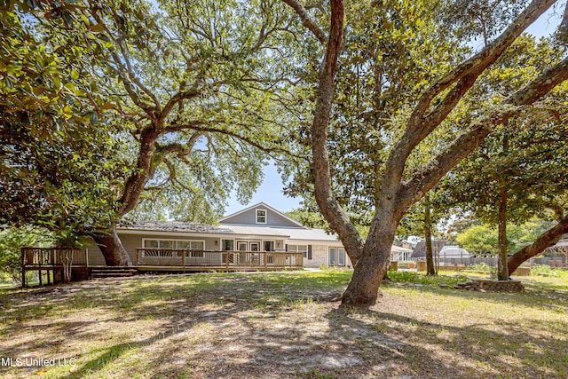 rear view of house with a deck