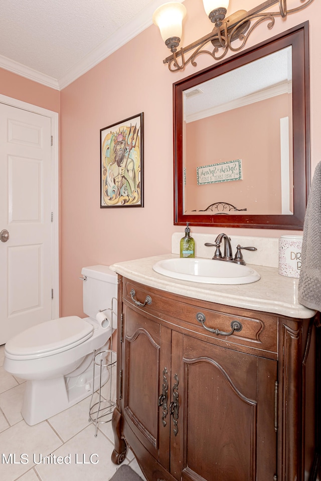 bathroom featuring vanity, ornamental molding, toilet, and tile patterned flooring