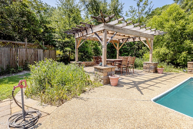 view of swimming pool featuring a pergola, a patio area, and an outdoor fire pit