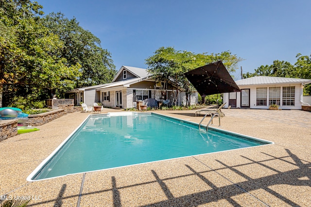 view of pool featuring a patio area