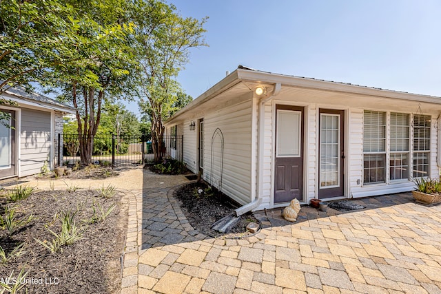 view of property exterior with a patio