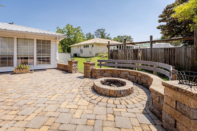 view of patio / terrace with an outdoor fire pit