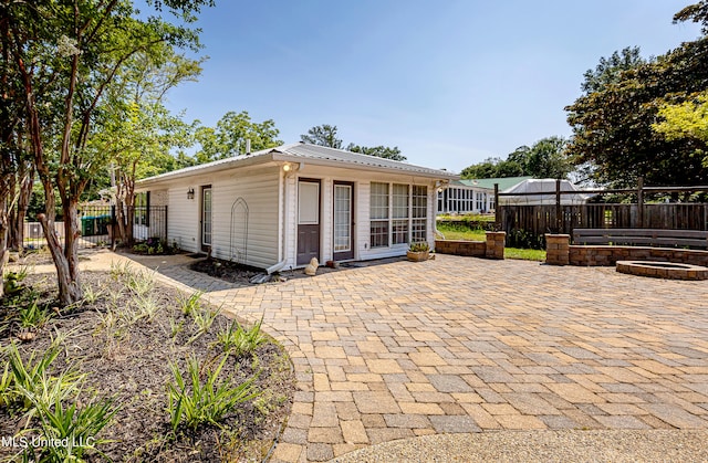 view of outdoor structure with a fire pit