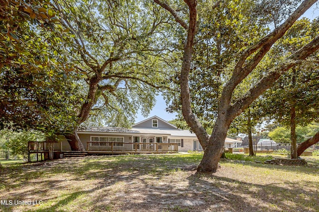 exterior space featuring a wooden deck