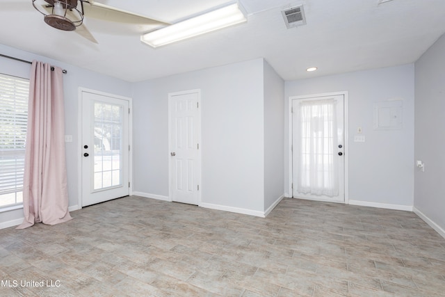 entrance foyer featuring ceiling fan