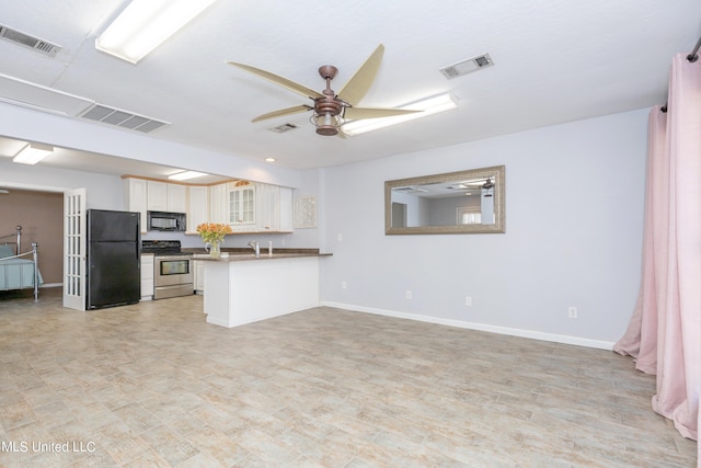 kitchen featuring black appliances, white cabinets, kitchen peninsula, and ceiling fan