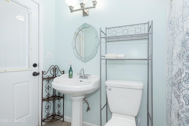 bathroom with toilet and sink