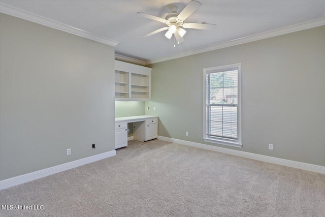 unfurnished bedroom featuring ceiling fan, light colored carpet, and crown molding