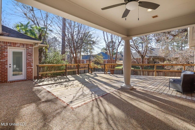 view of patio with a wooden deck and ceiling fan