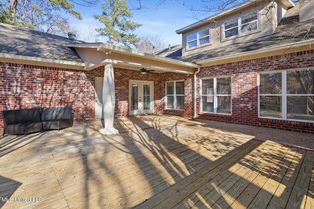 deck with ceiling fan and french doors