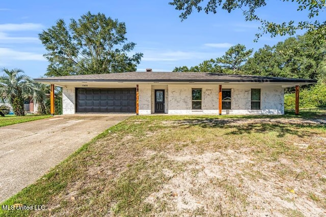 ranch-style home with a front yard and a garage