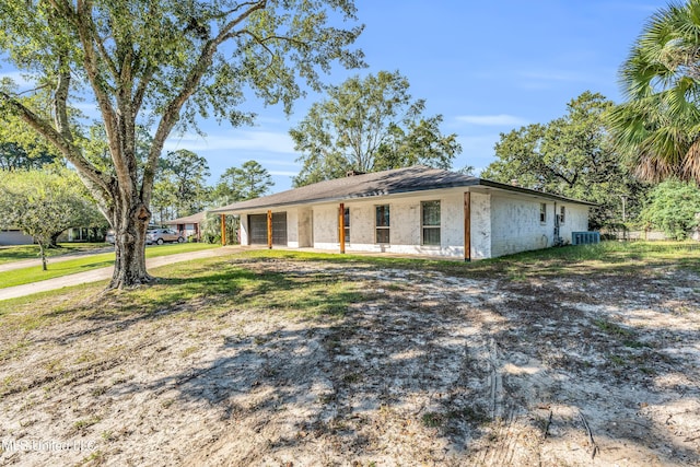 ranch-style home featuring cooling unit